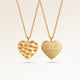 Personalized heart-shaped gold necklace with rippled wave surface and space for engraving of text, coordinates or handwriting on the back