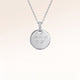 Personalised round silver necklace with white zirconia and engraved date and initial – room for text, coordinates or handwriting on the back