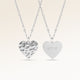 Personalized heart-shaped silver necklace with rippled wave surface and space for engraving of text, coordinates or handwriting on the back